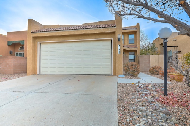 southwest-style home with a garage