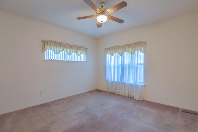 carpeted empty room with ceiling fan