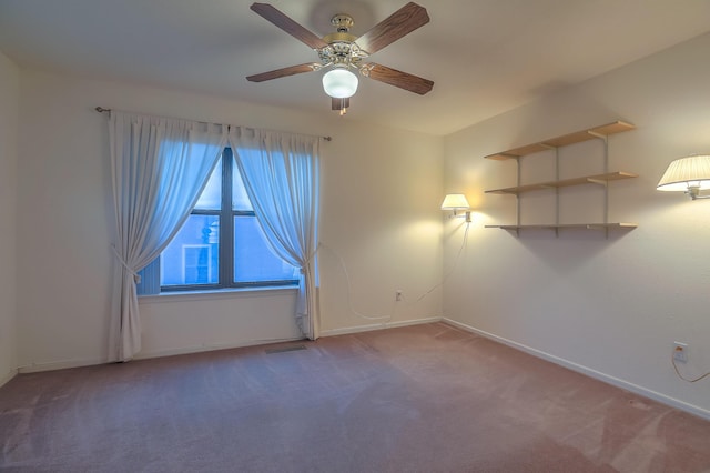 empty room with carpet and ceiling fan