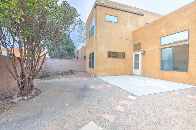 back of house with a patio area