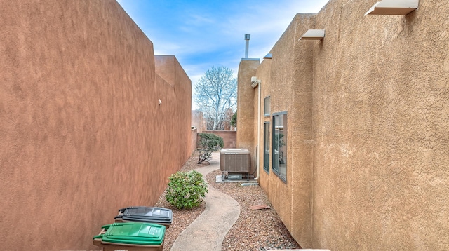 view of side of property featuring central air condition unit