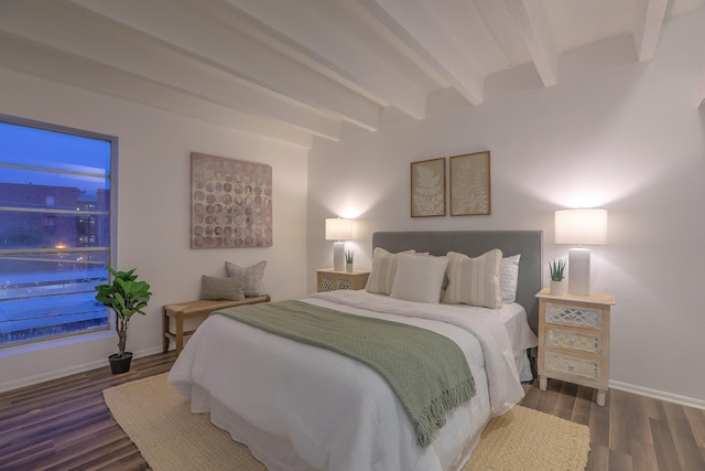 bedroom featuring beam ceiling and dark wood-type flooring