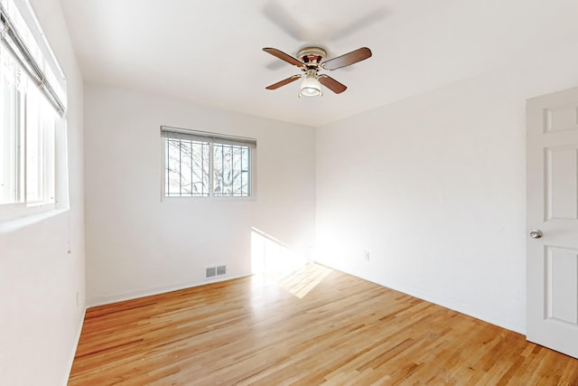 unfurnished room with ceiling fan and light hardwood / wood-style floors