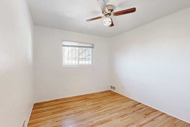 unfurnished room featuring ceiling fan and light hardwood / wood-style flooring