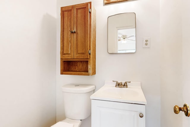 bathroom featuring ceiling fan, vanity, and toilet