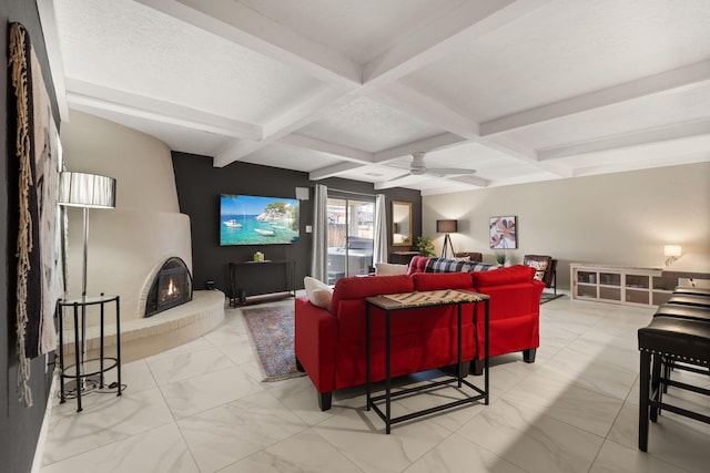 living room with beam ceiling, ceiling fan, and coffered ceiling