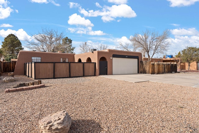 southwest-style home with a garage