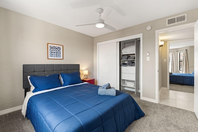 bedroom with carpet floors, a closet, and ceiling fan