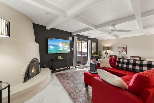 living room featuring a textured ceiling, ceiling fan, beamed ceiling, and coffered ceiling