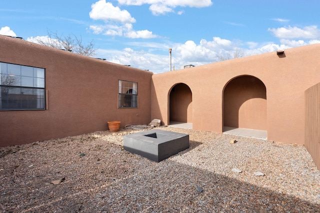 view of patio / terrace with an outdoor fire pit