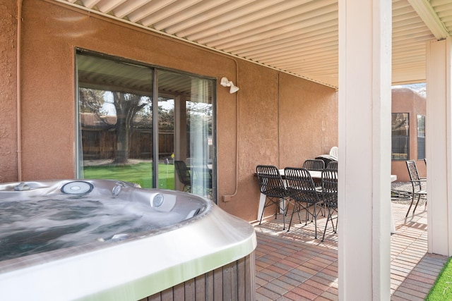 view of patio with a hot tub