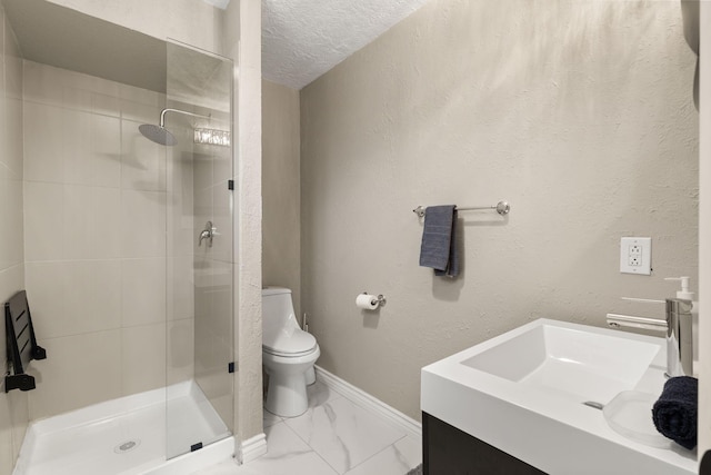 bathroom with toilet, a tile shower, a textured ceiling, and vanity