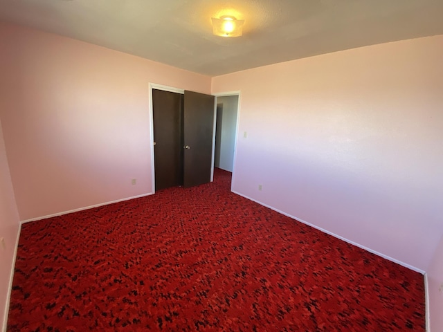 unfurnished bedroom with carpet floors