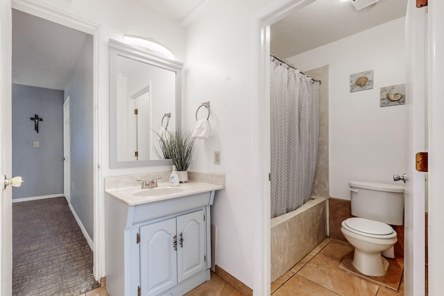 415 Wheeler Ave SE, Albuquerque, NM 87102 - full bathroom with toilet, vanity, tile patterned flooring, shower / bath combo with shower curtain, and baseboards