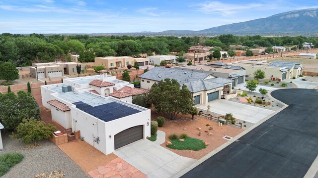 birds eye view of property with a mountain view