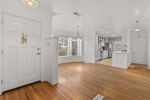 foyer with light hardwood / wood-style floors