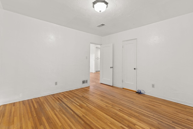 empty room featuring light hardwood / wood-style floors