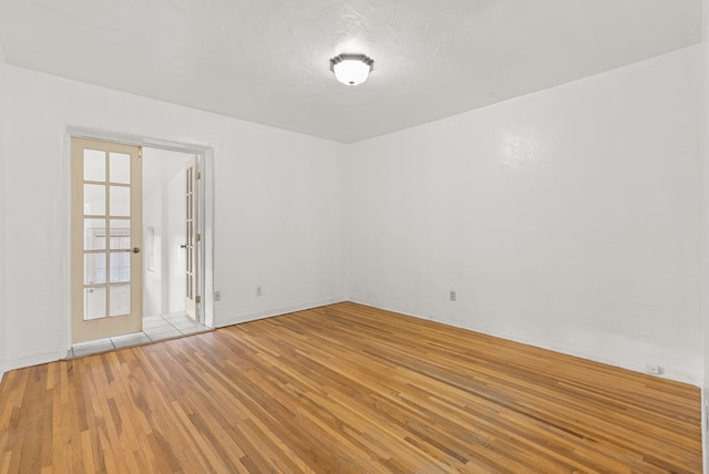 spare room featuring light wood-type flooring