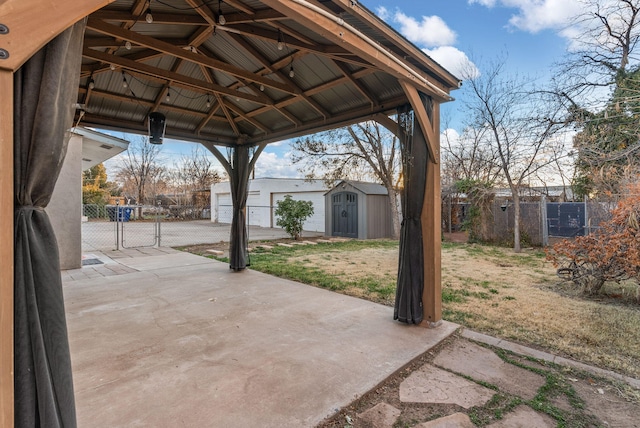 view of patio with a gazebo and a storage shed