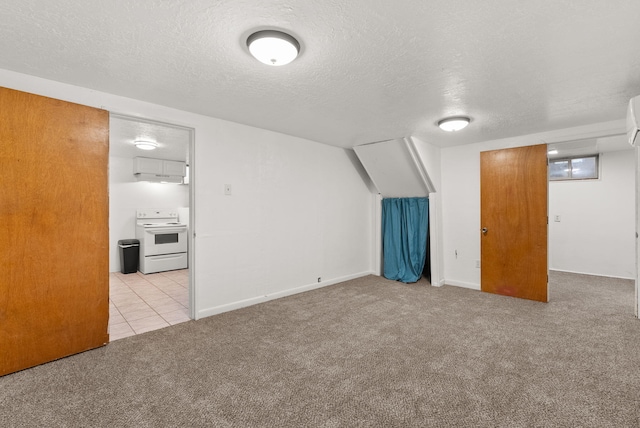 bonus room featuring a textured ceiling and light carpet