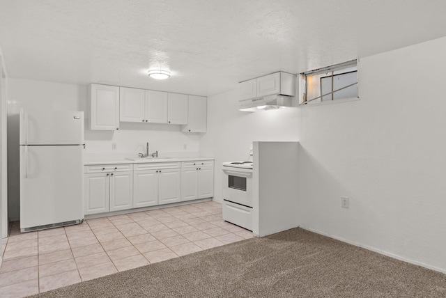 kitchen featuring light tile patterned flooring, white appliances, white cabinetry, and sink