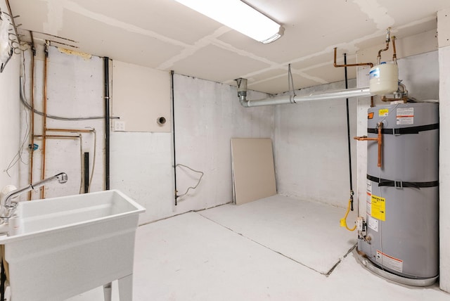 basement with gas water heater and sink