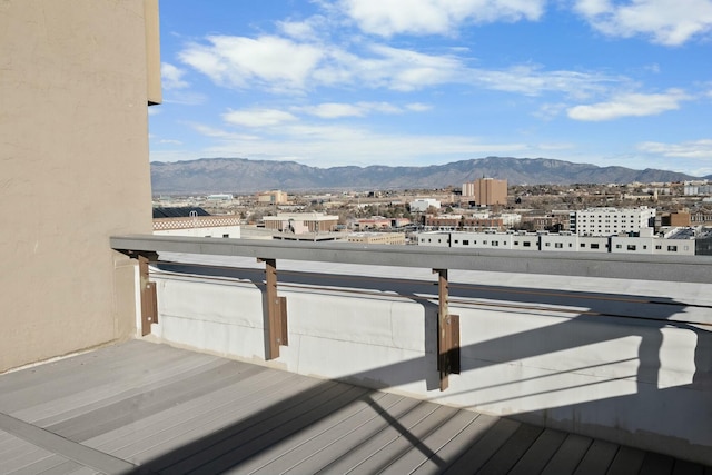 wooden deck featuring a mountain view