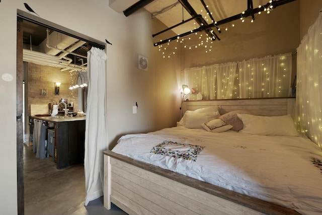 bedroom featuring concrete flooring and sink