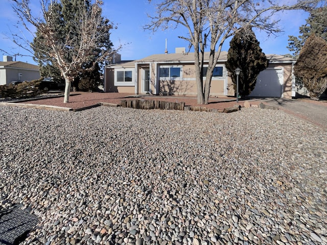 ranch-style house featuring a garage