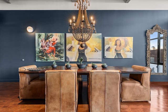 dining room featuring an inviting chandelier and dark wood-type flooring