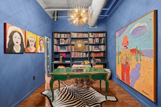 office area featuring hardwood / wood-style floors and a notable chandelier