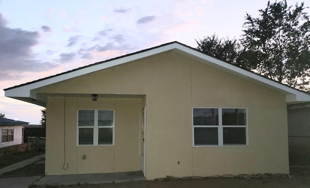 view of property exterior at dusk