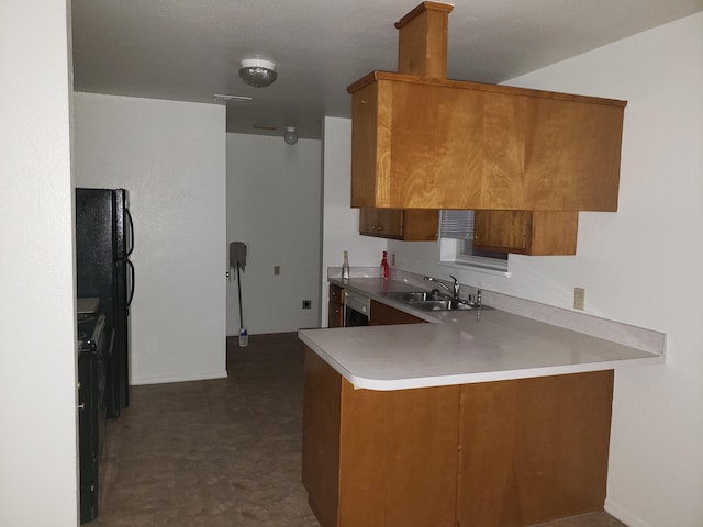 kitchen with black appliances, kitchen peninsula, and sink