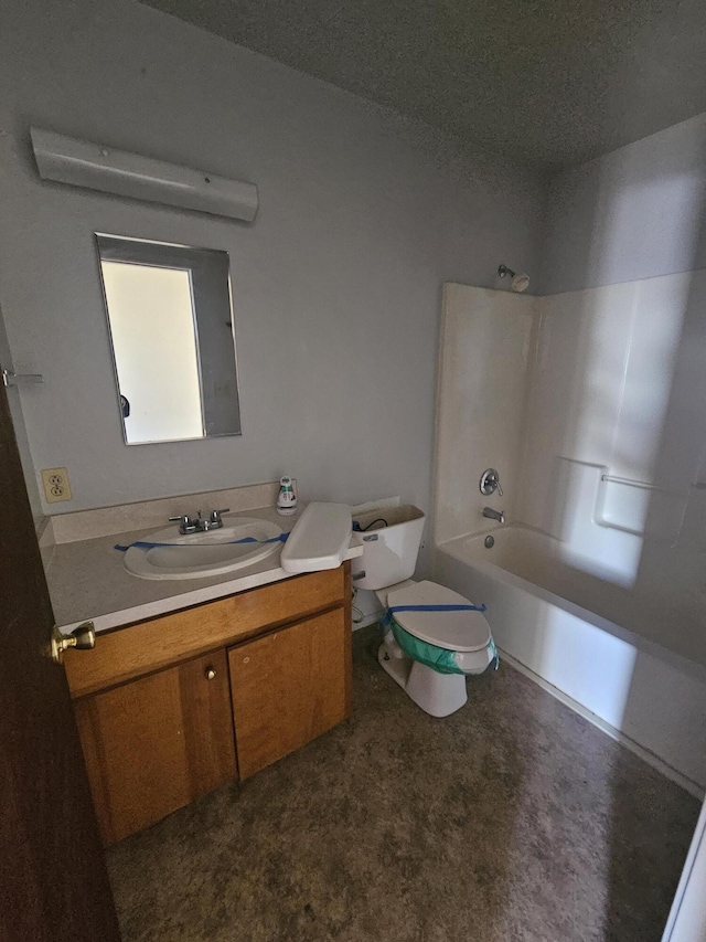 full bathroom with washtub / shower combination, a textured ceiling, vanity, and toilet