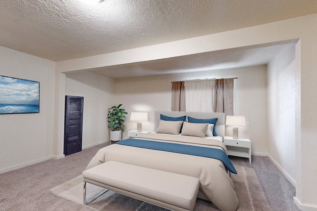 carpeted bedroom with a textured ceiling