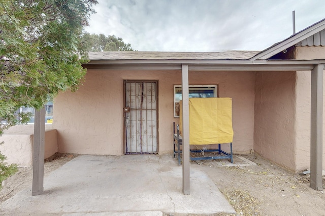 property entrance with a patio