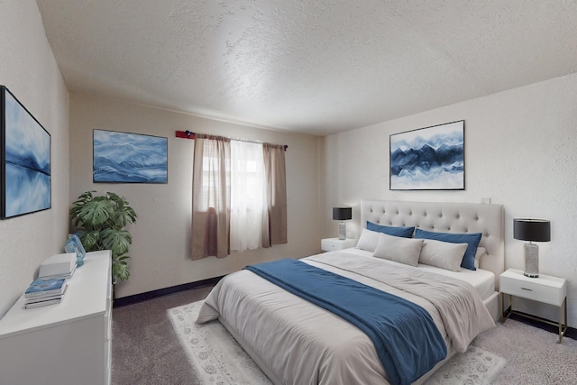 bedroom featuring carpet floors and a textured ceiling