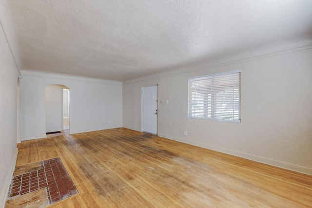 spare room with hardwood / wood-style flooring