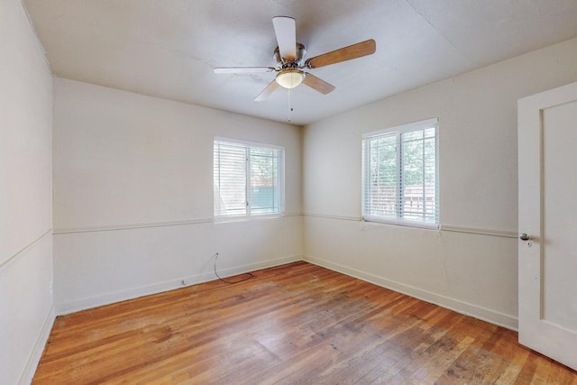 unfurnished room with ceiling fan and light wood-type flooring