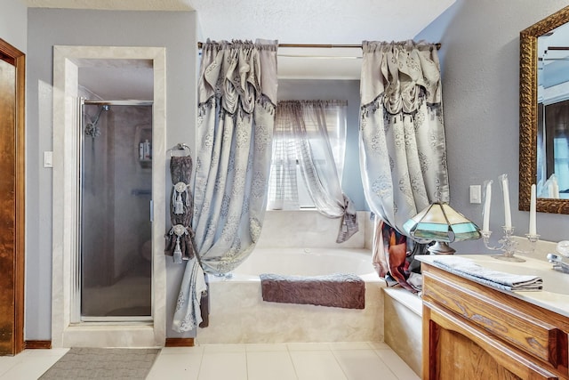 bathroom with separate shower and tub and vanity