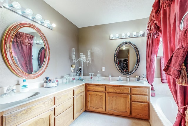 bathroom with tiled bath and vanity