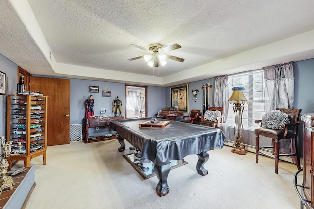 game room with a raised ceiling, ceiling fan, light colored carpet, and billiards