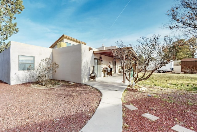 view of front of home with a patio area