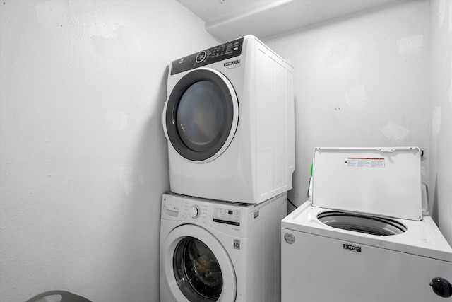 laundry area featuring stacked washer and dryer