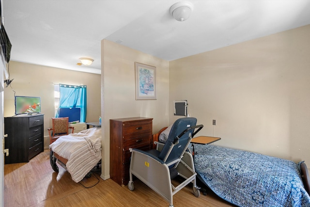 bedroom with light hardwood / wood-style floors