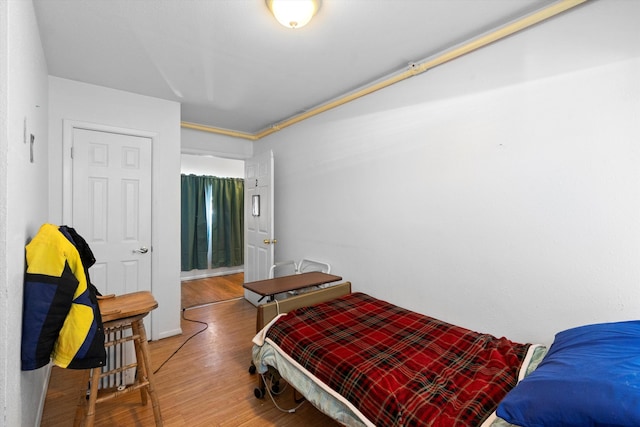 bedroom with hardwood / wood-style floors