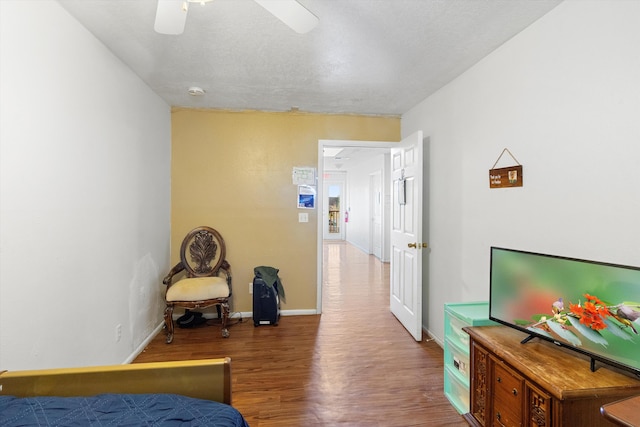 bedroom featuring ceiling fan and hardwood / wood-style floors