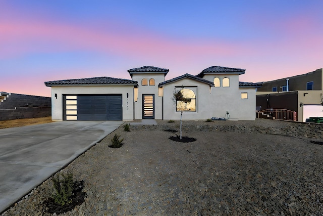 view of front of property with a garage