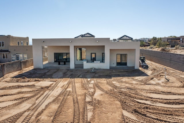 rear view of property with a patio area