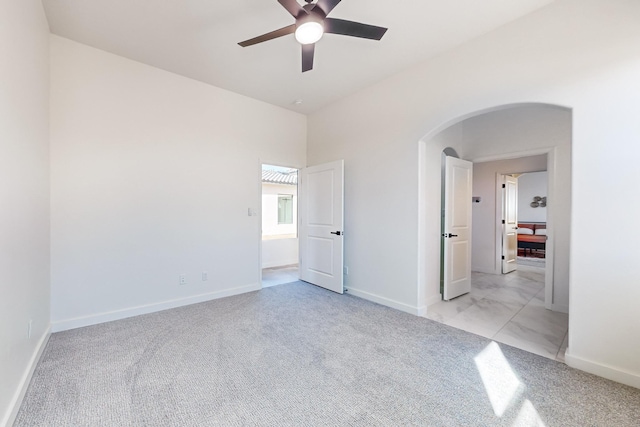 unfurnished bedroom with ceiling fan and light carpet